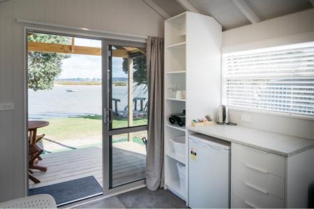 Waterfront Deluxe Cabin
Whangateau Holiday Park